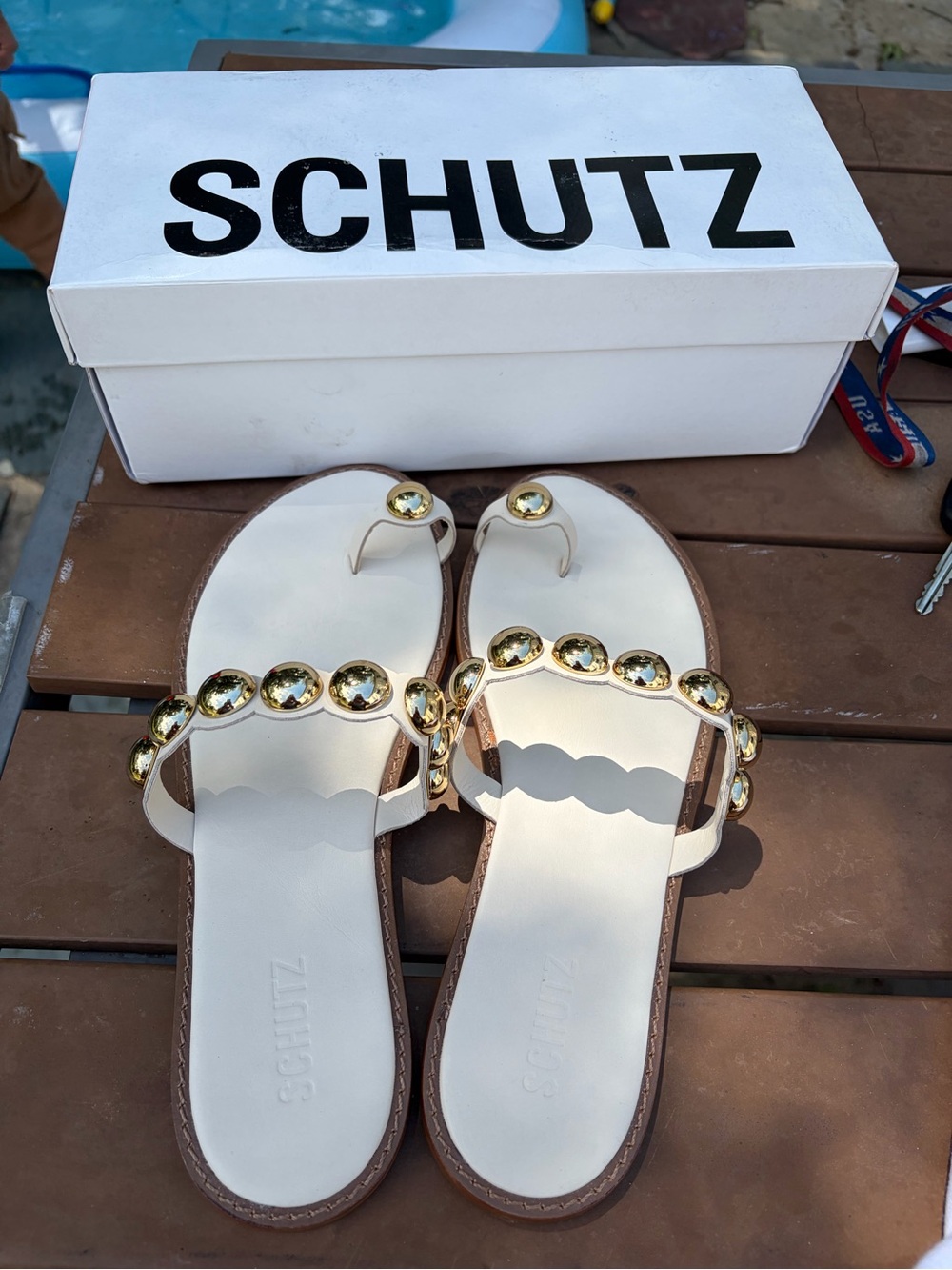 SCHUTZ Ivory Slip-On Sandals with Gold Gem Embellishments